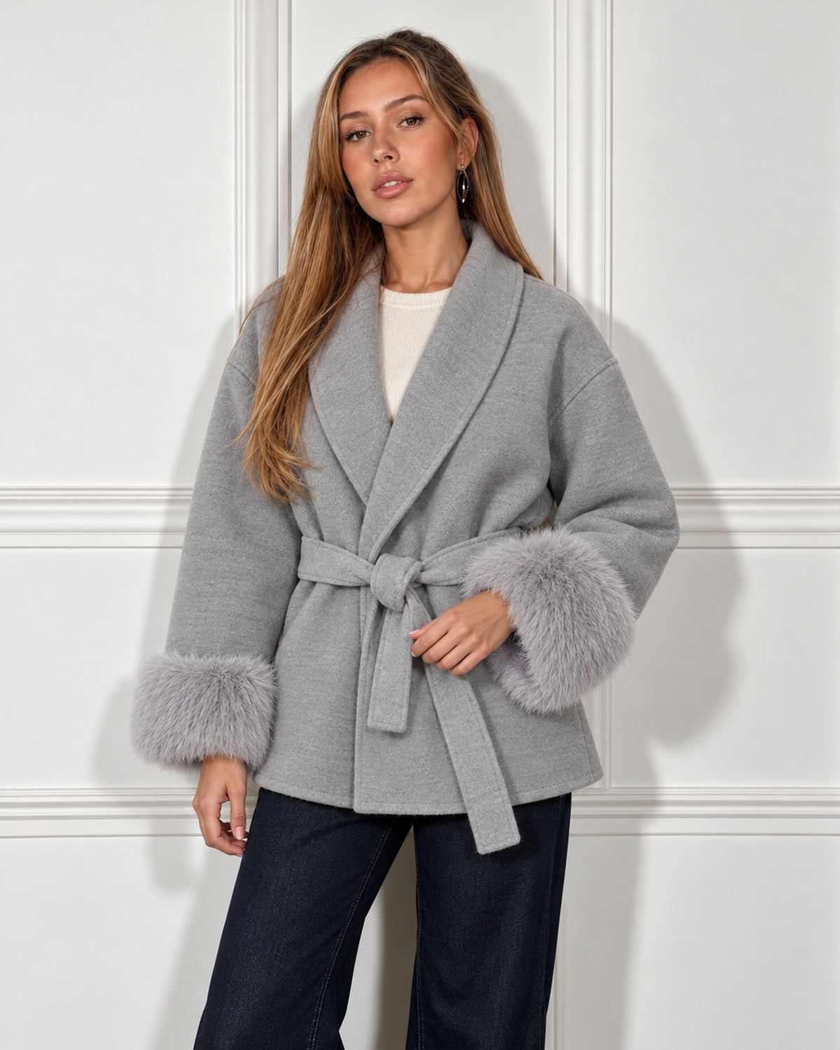 Belted shawl-collar coat in grey, worn by a model