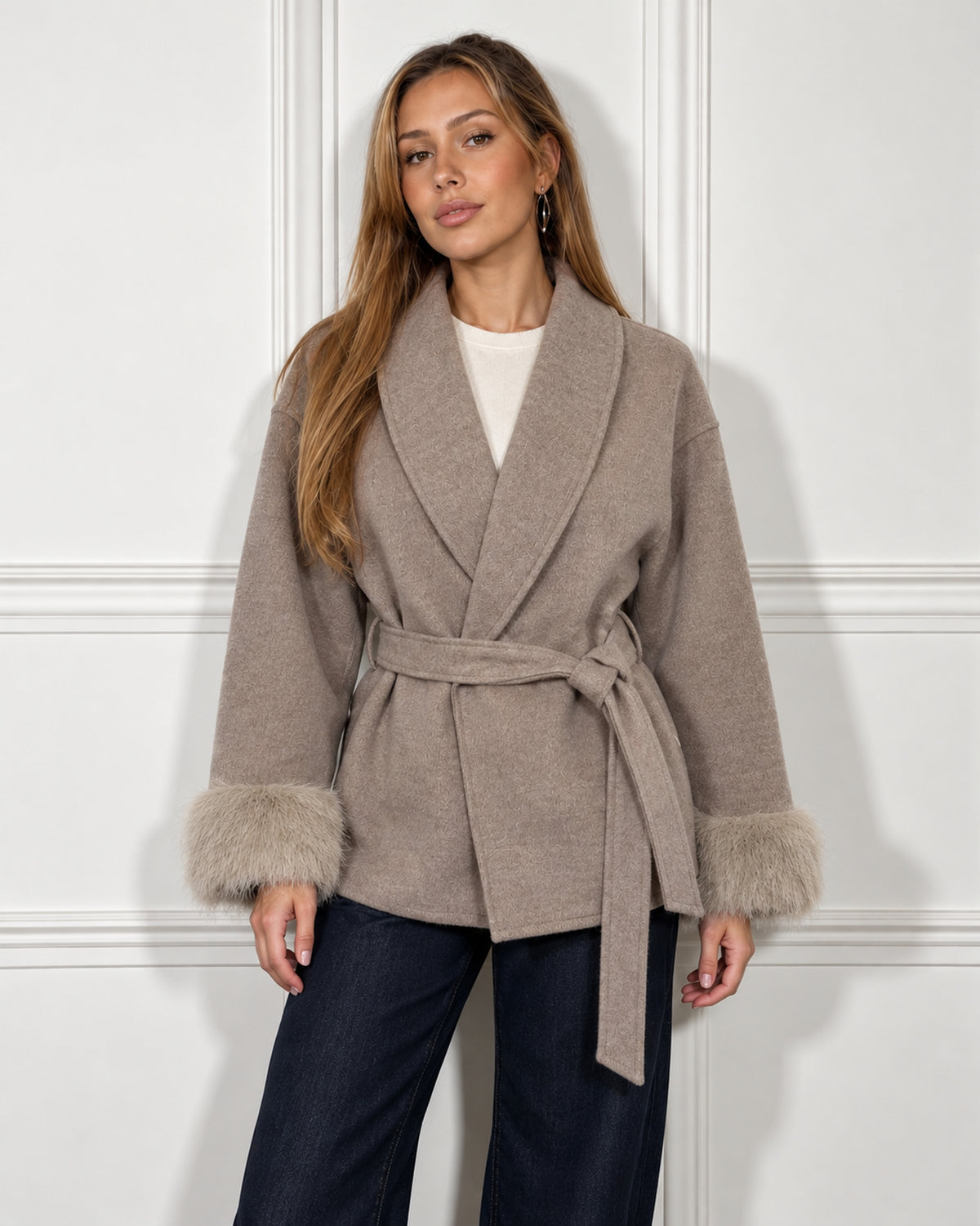 Belted shawl-collar coat in oatmeal, worn by a model