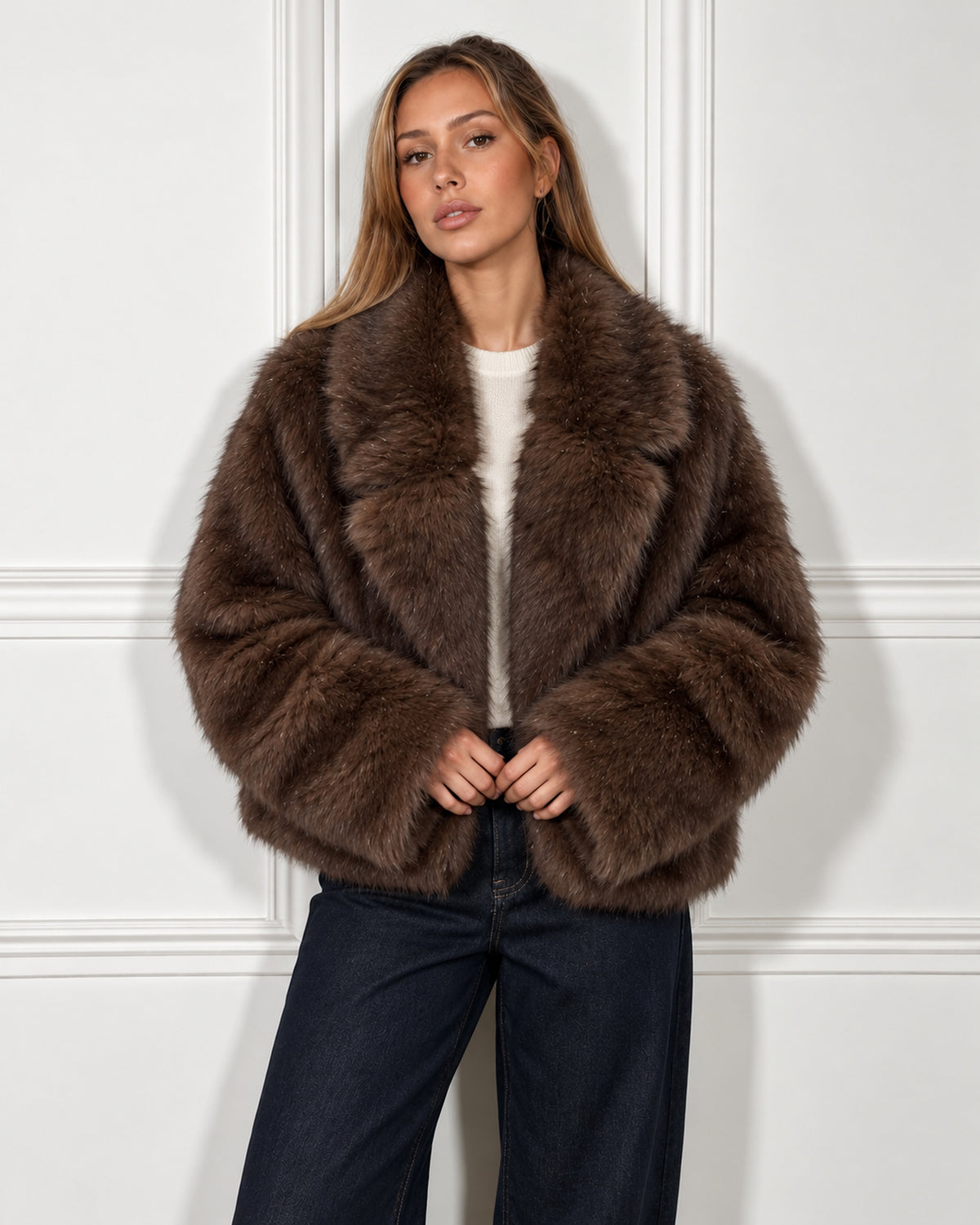 Oversized faux fur jacket in brown, worn by a model, front