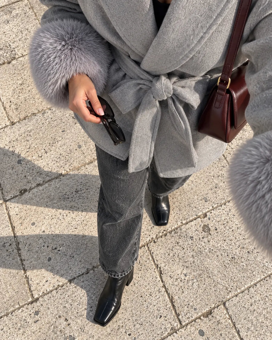 @lea.moret wearing the grey belted shawl-collar coat, detail